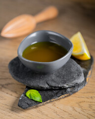 Lemon italian sauce in rustic style close up on wooden table