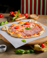 Classic italian pizza with prosciutto for children looking like a bear
