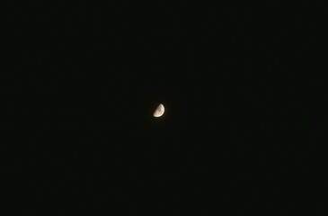 half moon on dark sky in night