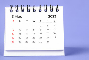 The March 2023 Monthly desk calendar for 2023 year on purple background.