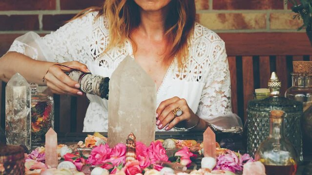 beautiful altar with crystals and rose flowers.