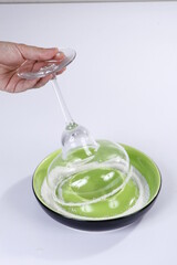 Salt being placed on cocktail glass