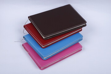 Stitched faux leather notebooks in different colors