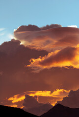 Horizon at sunset, dramatic sky with intense colors in rural Guatemala, bright colors and silhouettes of mountains.