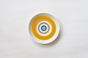 Top shot of a ceramic bowl with colorful circles