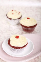 Red velvet cupcakes with hearts for Valentine's Day