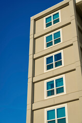 Fototapeta na wymiar Building exterior with square paned windows in a low angle view at Destin, Florida