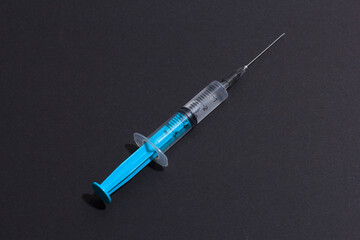 Disposable plastic syringe prepared for injection and vaccination in the hospital. The concept of medicine and health