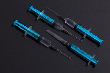 Disposable plastic syringe prepared for injection and vaccination in the hospital. The concept of medicine and health