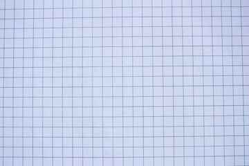 Checkered paper texture background. Notebook page surface. Copy space for text. Blank paper backdrop.