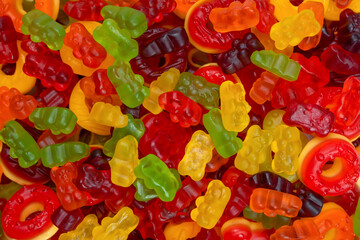 Assorted colorful gummy candies. Jelly donuts. Jelly bears.