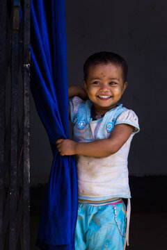 A Child From A Rural Area Looking Happy Even In A Grubby Condition.