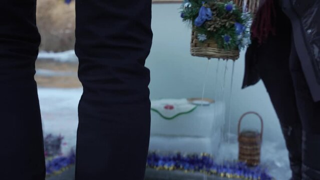 Jar in a bucket full of water for baptism 