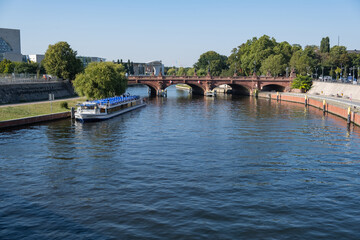 Tourist boat in Spree river in the middle of Berlin, Germany