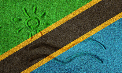 Flag of Tanzania on the sand. Sun and sea waves painted on the sand. Vacation concept in the resorts of the Tanzania and Zanzibar.