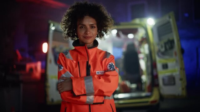 Portrait of Beautiful, Multiethnic, Female Paramedic Specialist on Late Night Shift. Heroic Empowering Woman Smiling and posing for Camera, Reporting for Duty to Save Lives and Treat Emergencies