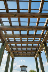 Destin, Florida- View of a wooden outdoor roof grid under the clear sky