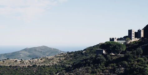 Fototapeta na wymiar Monestir Sant Pere de Rodes in Port de la Selva in the province of Girona in Catalonia, Spain. View of Llansá and Port de la Selva, north of Cap de Creus. Landscape of the Costa Brava.