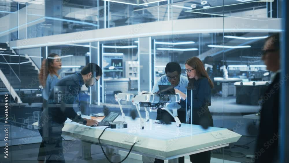 Aufkleber professional multicultural team of female and male engineers use industrial programmable robot anima