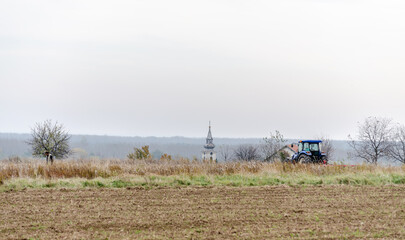Fototapeta premium Fields before winter plowing with the remains of cut corn.