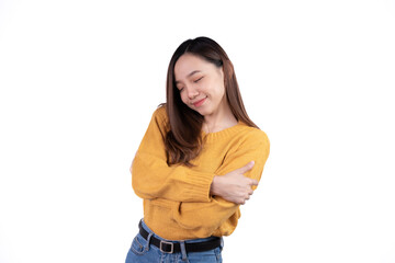 Young business woman hugs herself, smiling carefree and happy isolated on white background.