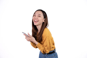 Portrait of a smiling casual asian woman holding smartphone over white background.
