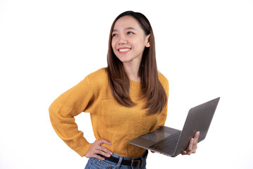 Portrait of a happy asian businesswoman holding laptop computer and looking away isolated over white background.