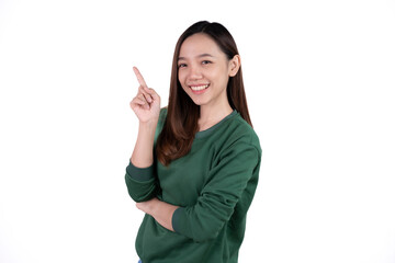 Young beautiful smiling good mood positive girl pointing finger in copyspace isolated on white background.