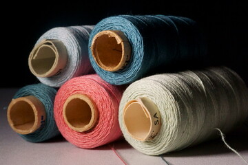 Background with colored sewing threads on spools