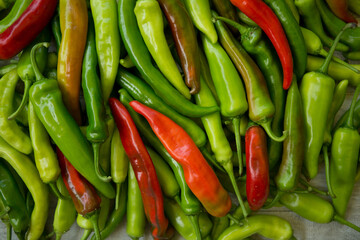 Hot chili pepper background. Red and green peppercorns as a background. Healthy food concept.