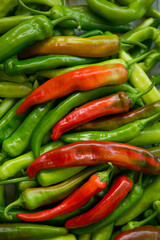 Hot chili pepper background. Red and green peppercorns as a background. Healthy food concept.