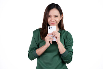 Portrait of a smiling casual asian woman holding smartphone over white background.