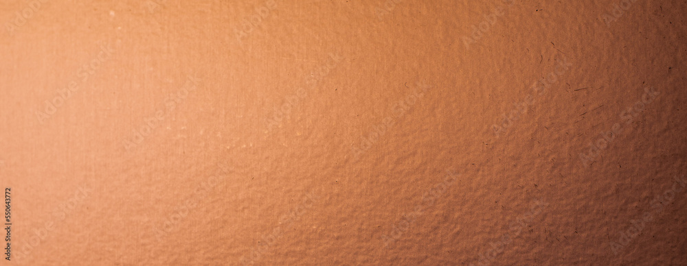 Wall mural sheet metal painted a copper color. background or texture