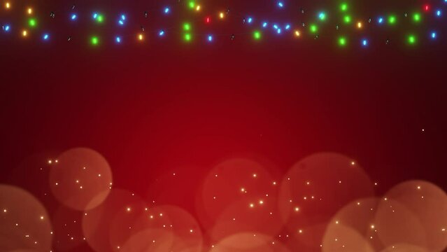 light bulb string with bokeh on red background. gold dust particles. 4k resolution, coloured theme christmas.