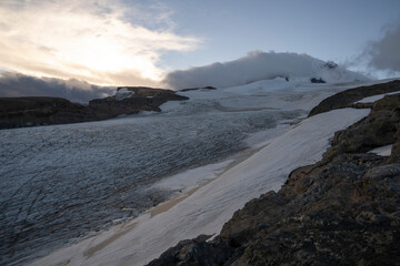 Fototapeta premium Alpine landscape. View of Tronador hill and Castaño Overo glacier ice field at sunset in the Andes cordillera, Patagonia Argentina.