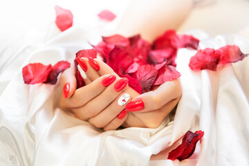 red nails with rose petals