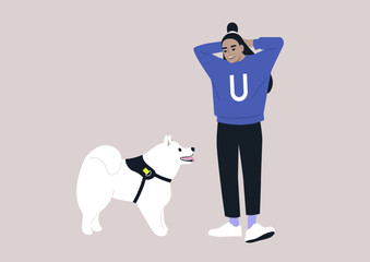 A young female Asian pet owner and their samoyed dog looking at each other, friendship with animals