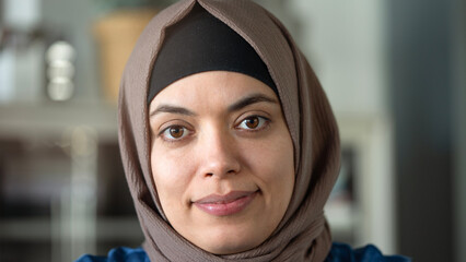 Woman looking at camera and wearing a hijab
