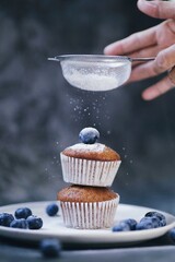 Close up master chef hands making a delicious muffin cake  in the kitchen bakery.