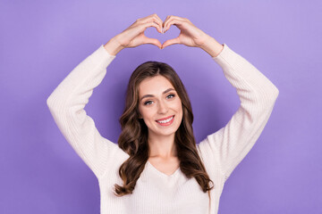Obraz na płótnie Canvas Photo of adorable shiny cute gorgeous positive lady wear white jumper smiling showing like love arms symbol isolated on violet color background