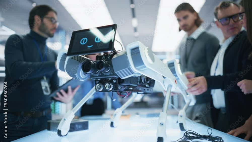 Aufkleber Close Up Robot Dog Prototype with Smiling Emoji Face on Display Standing in a High Tech Modern Industrial Facility. Industrial Robotics Team Working on Scientific Industrial Technology Project.