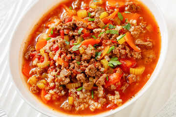 Hamburger Soup with barley and vegetables in bowl