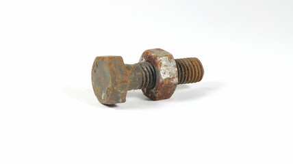 Closeup of a rusted bolt with a nut on a white background