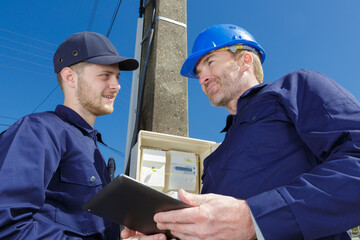 2 technician installation of a traffic light