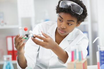 woman scientist holding dna molecule