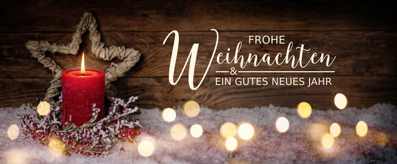 Fototapeta Christmas Greeting Card with German text Frohe Weihnachten und ein gutes neues Jahr. Merry Christmas and Happy New Year. Panorama, Banner. Christmas candle in winter snow landscape. obraz