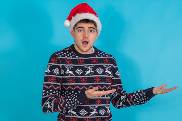 isolated young man with christmas clothes