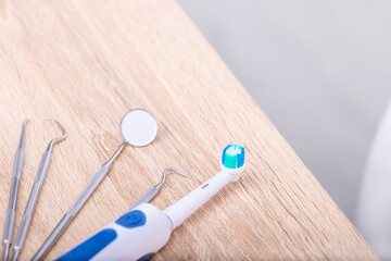 electric toothbrush with dental tools