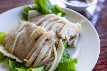 Steamed Hainanese chicken dish in restaurant