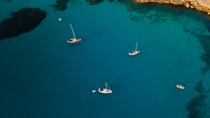 aerial imagery 4k of land and sea with boats